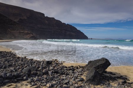 Photo for Atlantic waves approaching the volcanic shore at Orzola, Lanzarote - Royalty Free Image