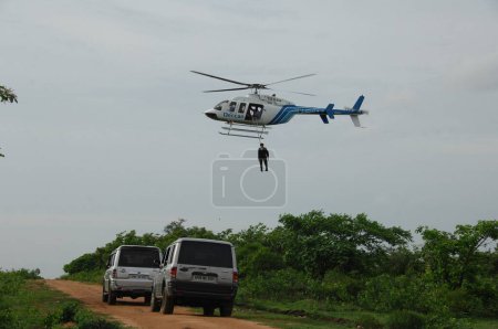 Photo for MAN BODY HANGING FROM HELICOPTER 5th Dec 2022 Hyderabad India - Royalty Free Image