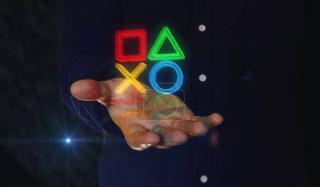 Joystick videojuego de consola de juegos y esports cibernéticos símbolo 3d sobre la mano del hombre. Icono de tecnología cibernética ilustración concepto abstracto.