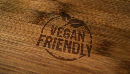 Vegan sello amistoso impreso en caja de madera. Concepto de comida orgánica vegetariana.