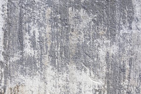 Ein abstraktes Bild der Textur von grauen und weißen Betonfliesen. 
