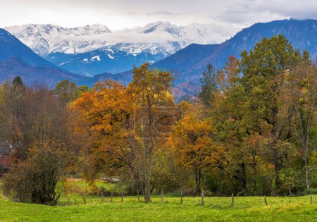 Autumn scenic with the view from the town Murnau to the alps