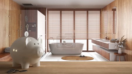 Photo for Wooden table top or shelf with white piggy bank with coins, japandi wooden bathroom in minimal style, expensive home interior design, renovation restructuring concept architecture - Royalty Free Image