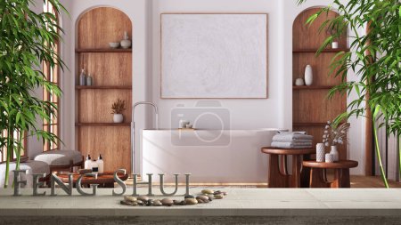 Foto de Estante de mesa vintage de madera con balanza de guijarros y letras 3d que hacen que la palabra feng shui sobre el baño minimalista japandi, diseño interior concepto zen - Imagen libre de derechos