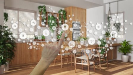 Photo for Glowing smart home interface, geometric background, connected line and dots showing internet of things system, hand pointing icons over kitchen interior, home automation concept - Royalty Free Image