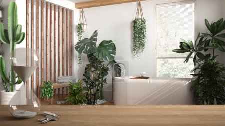 Wooden table or shelf with crystal hourglass measuring the passing time over modern bathroom with houseplants, urban jungle interior design, copy space background