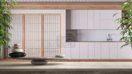 Foto de Mesa o estante vintage de madera con equilibrio de piedra y plantas de bambú, sobre cocina japonesa minimalista blanca, feng shui, diseño de interiores de arquitectura de concepto zen - Imagen libre de derechos