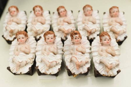 Photo for The figurines of Baby Jesus laying in a cradle - Royalty Free Image