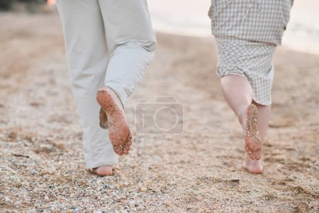 Photo for Sand on the feet and heels on the coast - Royalty Free Image