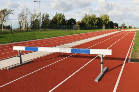 Empty stadium with barrier obstacle for competition
