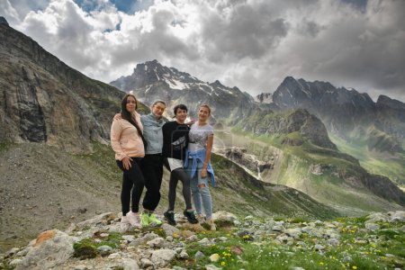 A group of girlfriends climbed high in the mountains