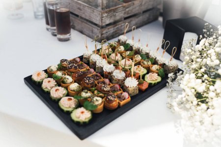 Photo for Small Canapes appetizers at the wedding - Royalty Free Image