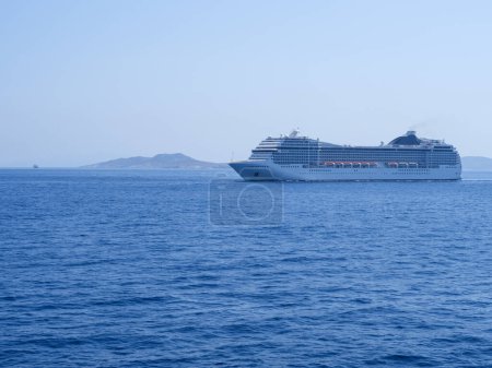 Photo for Large cruise liner in the sea port of Mykonos Island in Greece - Royalty Free Image