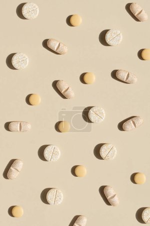 Photo for Nature colors pills on a neutral background, top view, copy space.  Seamless pattern - Royalty Free Image