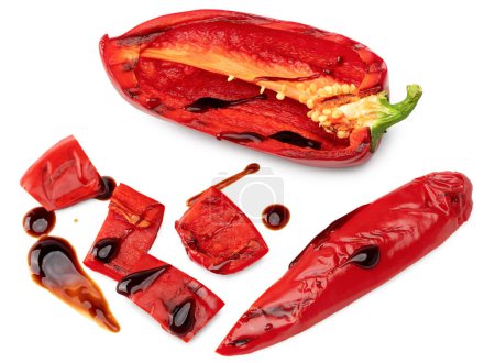 pieces of grilled red sweet bell pepper isolated on white background. clipping path. top view