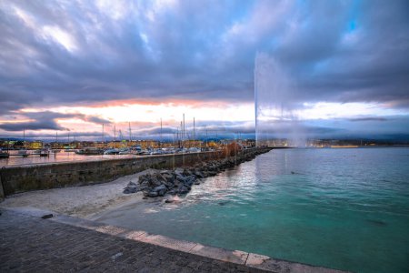 City of Geneva Lac Leman waterfront and Jet d Eau fountain sunset view, second largest city in Switzerland
