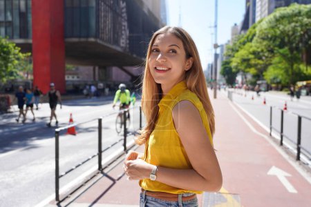Photo for Young woman visiting Paulista Avenue in Sao Paulo, Brazil - Royalty Free Image
