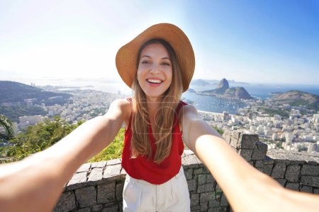 Self portrait of traveler girl with famous Guanabara Bay with Sugarloaf Mountain in Rio de Janeiro, UNESCO World Heritage, Brazil