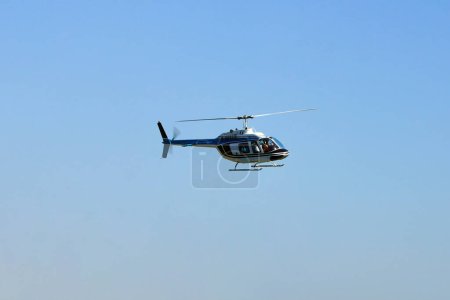 Photo for Helicopter in flight for sightseeing. Luxury lifestyle vacation. Tour on helicopter. - Royalty Free Image