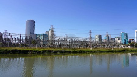 Photo for High-voltage power lines. Panoramic view of high voltage electric transmission from power plant Usina Elevatoria de Traicao on River Pinheiros in Sao Paulo, Brazil. - Royalty Free Image