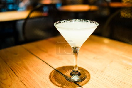 Photo for Margarita alcoholic cocktail with sugar on a bar.Selective focus image. High quality photo - Royalty Free Image
