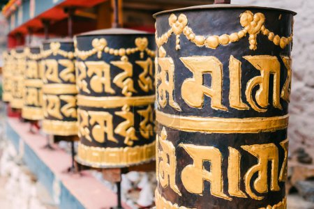 Photo for Gold and black religious prayer wheels in Bhutan. High quality photo - Royalty Free Image