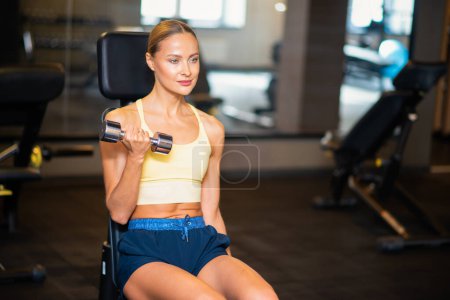 Photo for Portrait of a woman working out in a gym - Royalty Free Image