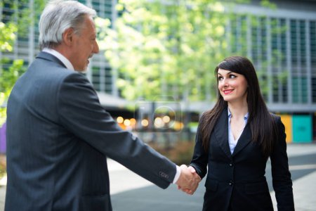 Photo for Business people shaking hands outdoor - Royalty Free Image
