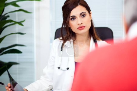 Photo for Female doctor talking to her patient - Royalty Free Image