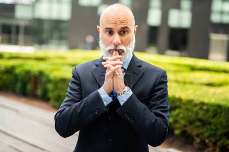 Photo for Mature bald stylish business man portrait outdoor in a pensive expression - Royalty Free Image