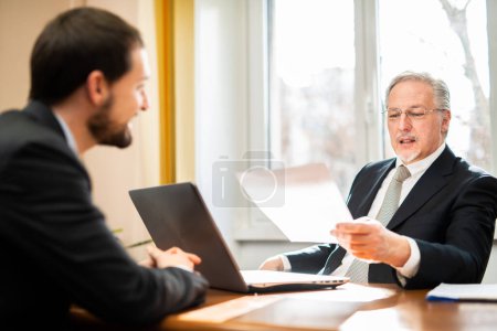 Photo for Two businessmen at job interview in an office - Royalty Free Image