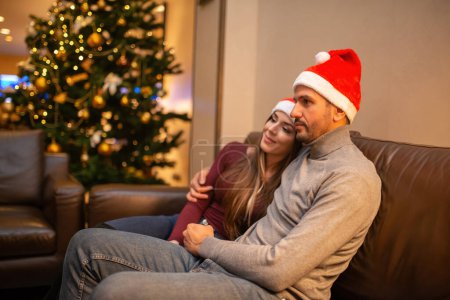 Photo for Couple at home together during Christmas eve - Royalty Free Image