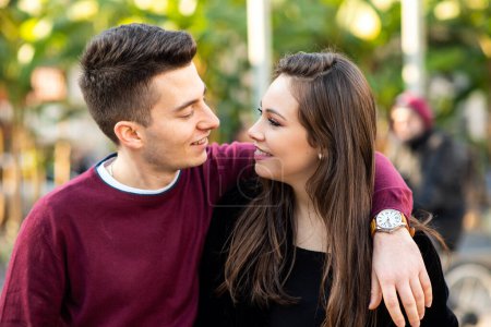 Photo for Young couple hugging outdoor with love - Royalty Free Image