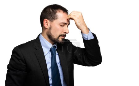 Photo for Young businessman in a thoughtful and stressed expression - Royalty Free Image