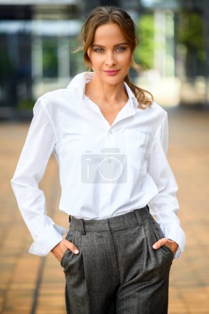 Photo for Beautiful businesswoman smiling outdoor in a modern city - Royalty Free Image