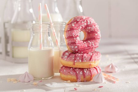 Sweet and delicious pink donuts ready to eat. Best tastes with milk. Most popular dessert.