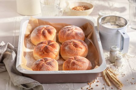 Tasty and homemade kaiser buns freshly baked in home bakery. Kaiser buns baked in a bakery.