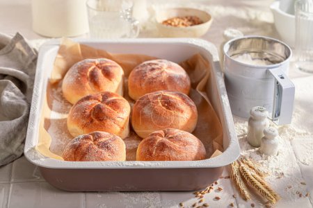 Tasty and homemade kaiser rolls baked fresh in the bakery. Kaiser buns baked in a bakery.