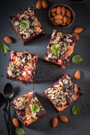 Homemade and sweet brownie with fruits and chocolate. Summer fruit cake .