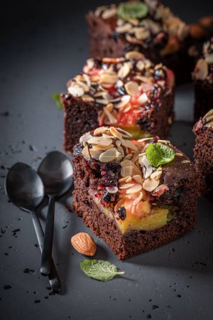Fresh and delicious brownie made of almond and fruits. Homemade cake.