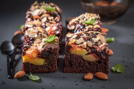 Sweet and tasty brownie made of almond and fruits. Vegan fruit cake.