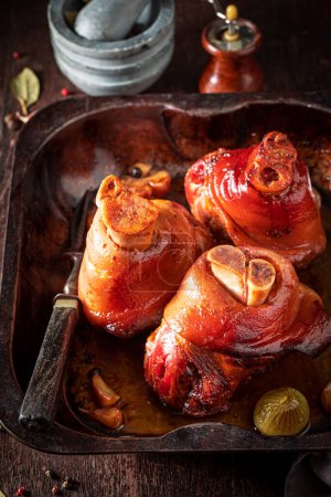 Roasted and homemade Schweinshaxe baked in casserole. Roasted Schweinshaxe with spices.