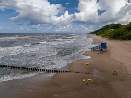 Lifeguard tower inundated at Baltic Sea during lightning storm, Poland. Aerial view of Baltic sea after storm.
