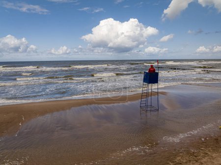 Lifeguard tower by Baltic Sea flooded during lightning storm, Poland. Aerial view of Baltic sea after storm.