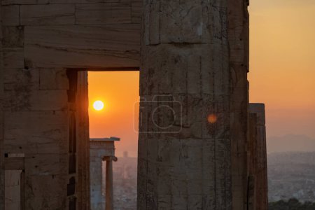 Photo for A picture of the sunset as seen through the ruins of Propylaea, the gateway to the Acropolis of Athens. - Royalty Free Image