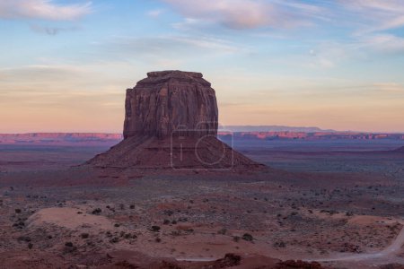 A picture of the Merrick Butte rock formation of Monument Valley, at sunset.