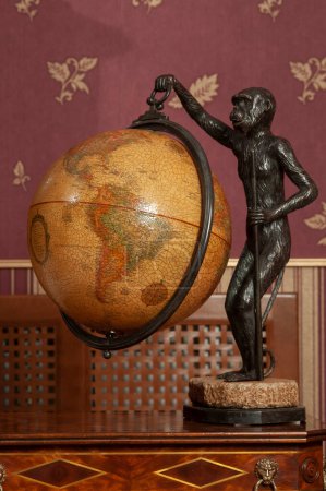 Antique world globe in the interior of a house.
