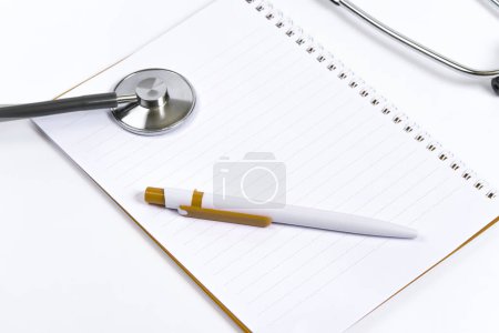 Photo for Top view doctor desk, shot from above of doctor table with notebook paper, pen, stethoscope flat lay display with copy space, top view photography project, medical doctor and healthcare concept. - Royalty Free Image