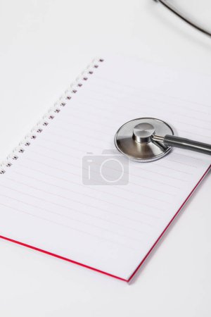 Photo for Doctor desk.Stethoscope and notebook on white background - Royalty Free Image