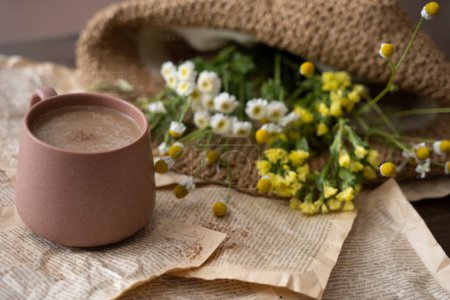 Photo for Cup of cappuccino with milk or cacao and wildflowers - Royalty Free Image